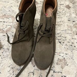 Woman’s olive green suede shoe by Clark’s